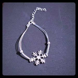 Handmade bracelet snowflake on double silver cord